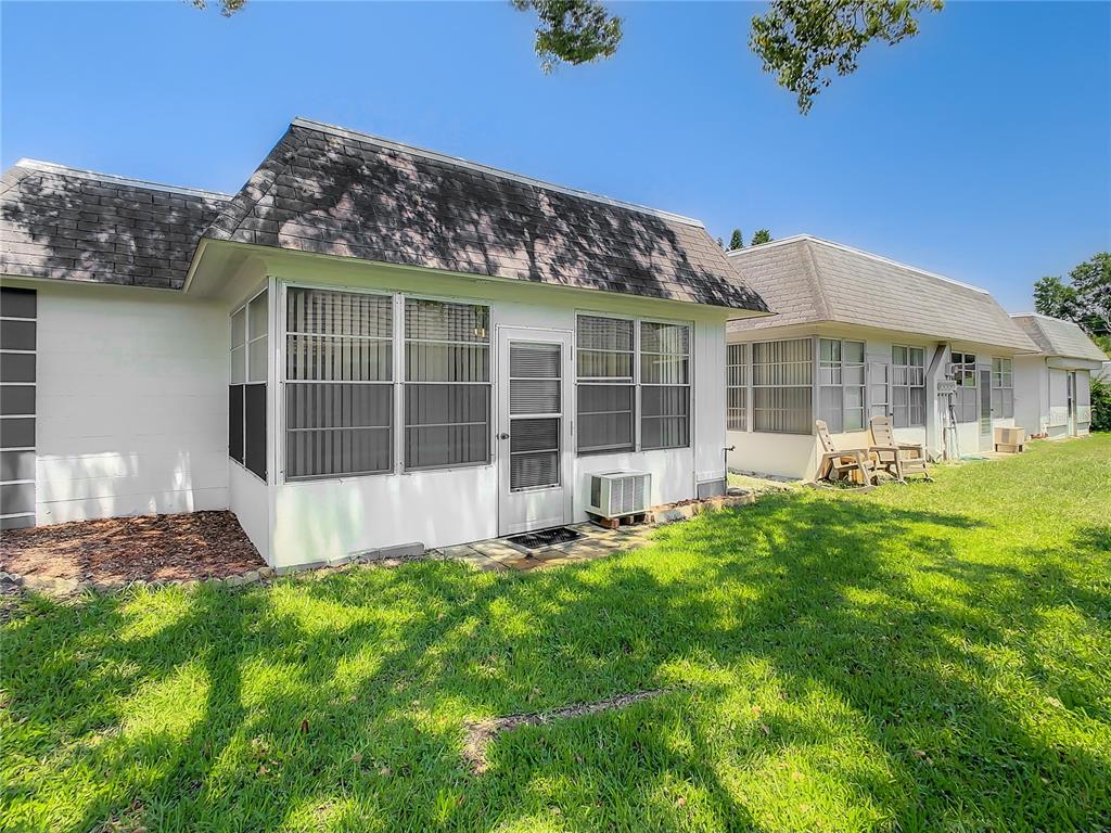 4230 Redcliff Place, Unit 4230 New Port Richey, FL 34652 - Photo 34 of 42 a view of an house with backyard space and balcony