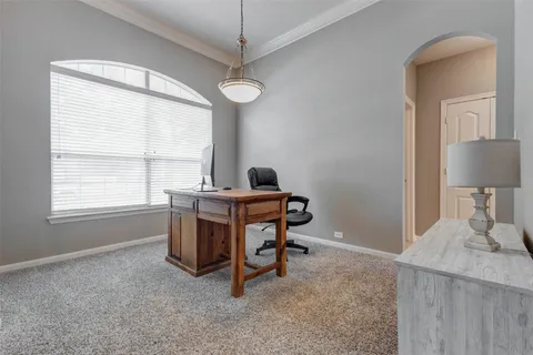 a view of a workspace with furniture