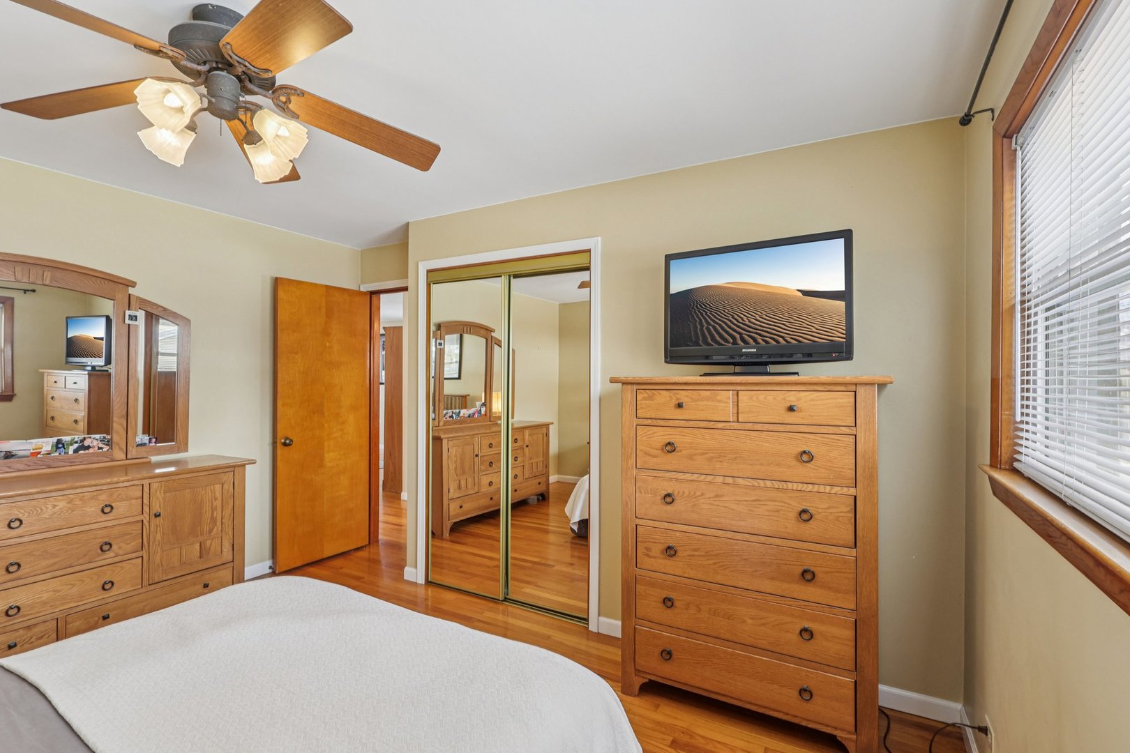 9219 South Spaulding Avenue Evergreen Park, IL 60805 - Photo 18 of 23 a bedroom with a bed and a flat screen tv