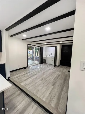 a utility room with cabinets washer and dryer