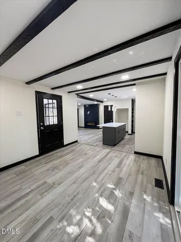 a kitchen with wooden cabinets and oven