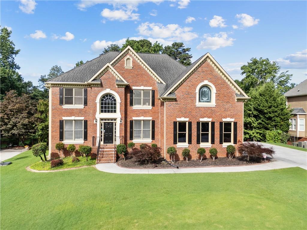 a front view of a house with a yard
