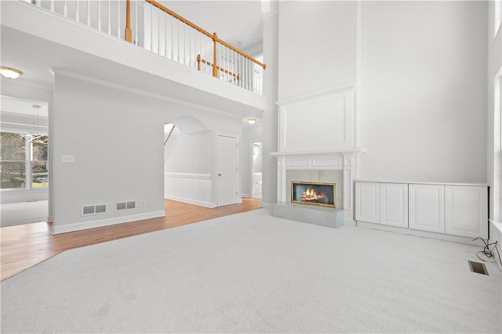 1810 Sunset Harbour Pointe Lawrenceville, GA 30043 - Photo 13 of 56 a view of an empty room with a fireplace and a window