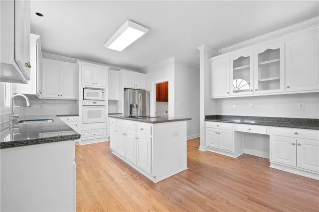 a view of cabinets with wooden floor