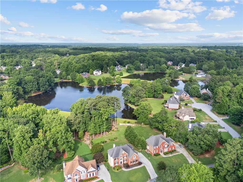 1810 Sunset Harbour Pointe Lawrenceville, GA 30043 - Photo 2 of 56 a view of a lake with green space