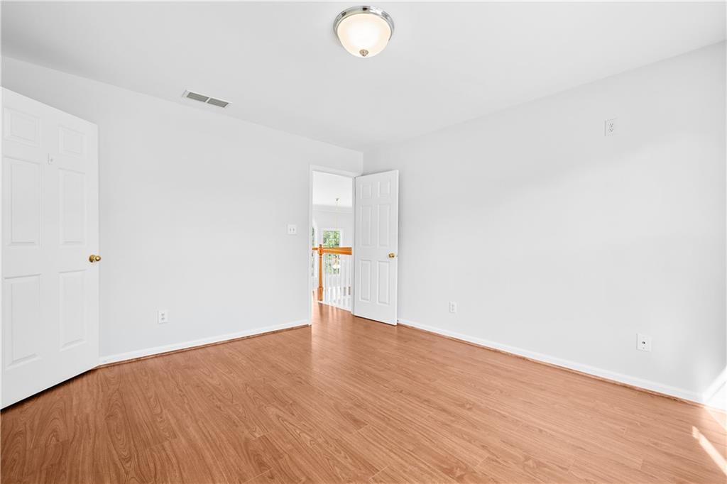1810 Sunset Harbour Pointe Lawrenceville, GA 30043 - Photo 39 of 56 a view of an empty room with wooden floor
