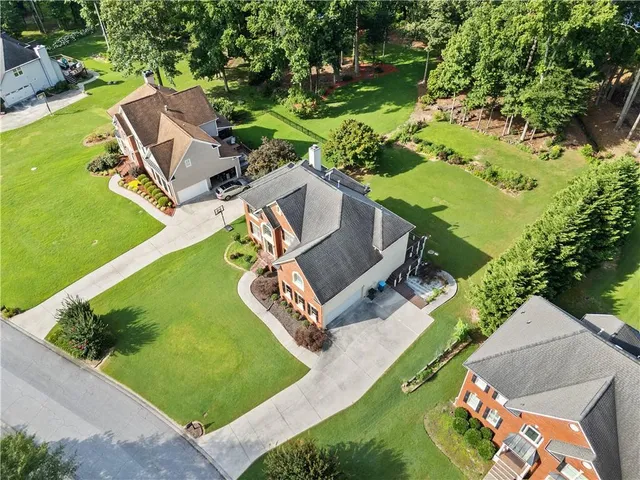 a view of a park with large trees