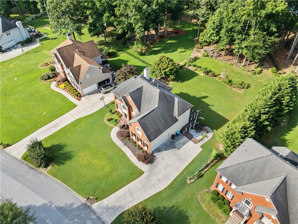 1810 Sunset Harbour Pointe Lawrenceville, GA 30043 - Photo 50 of 56 an aerial view of a house with a garden and swimming pool