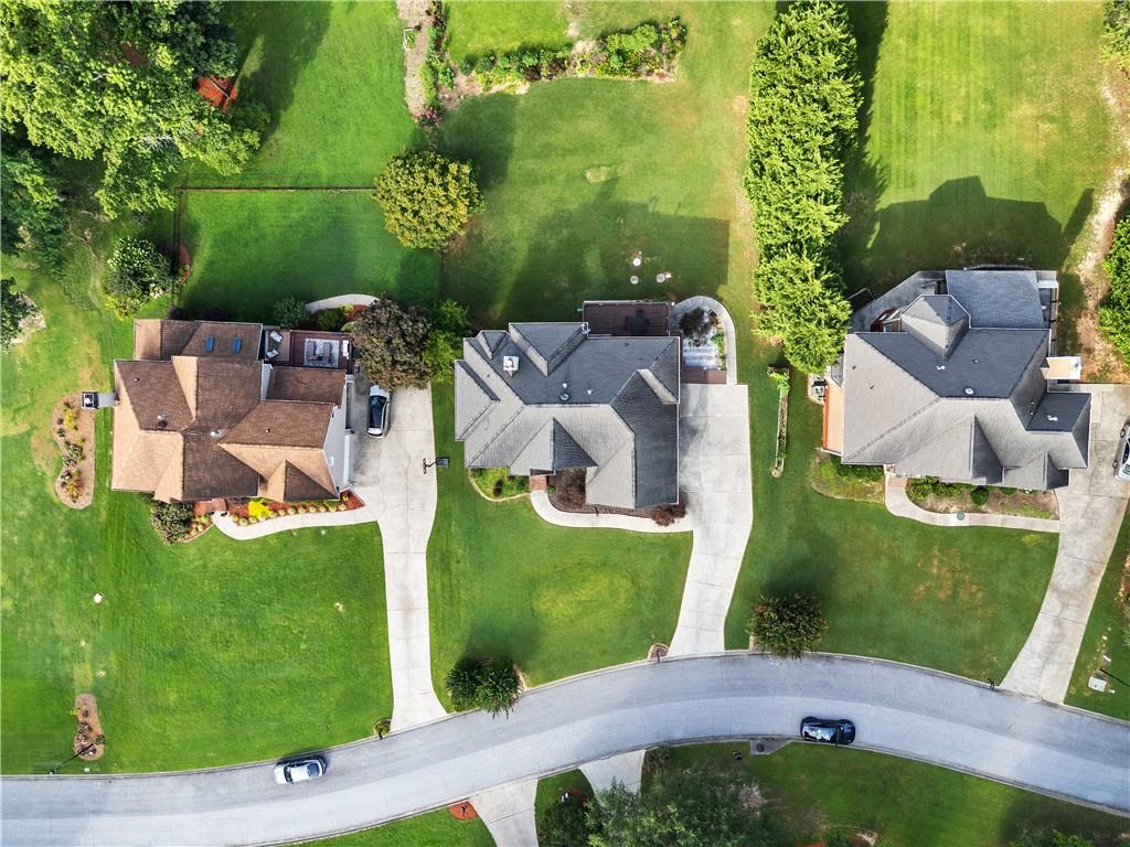 1810 Sunset Harbour Pointe Lawrenceville, GA 30043 - Photo 51 of 56 an aerial view of a house with a garden and swimming pool