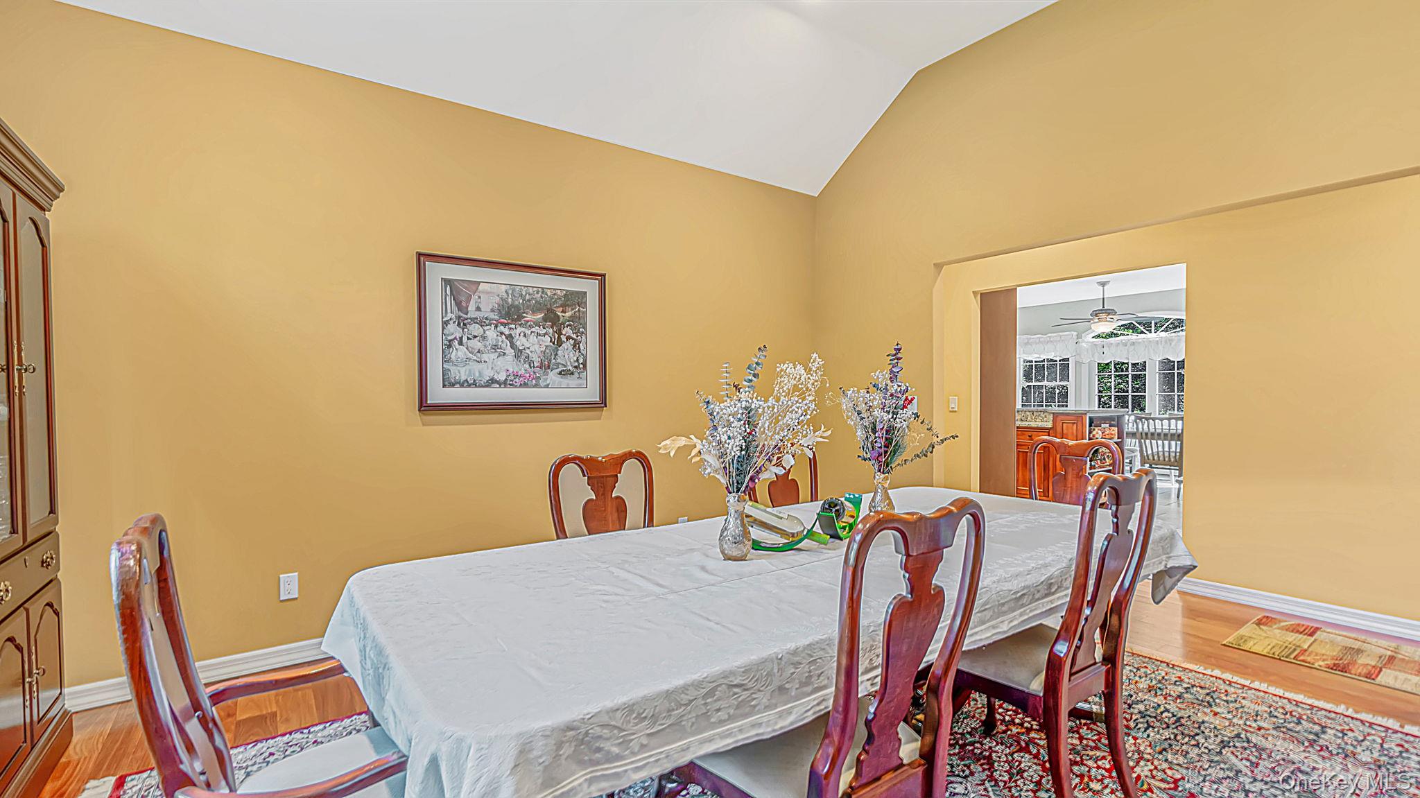 11 Valentine Road Shoreham, NY 11786 - Photo 4 of 40 Vaulted ceiling accentuates formal dining room with wood flooring, chandelier hook-up