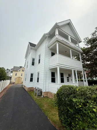 a large white building with a white roof