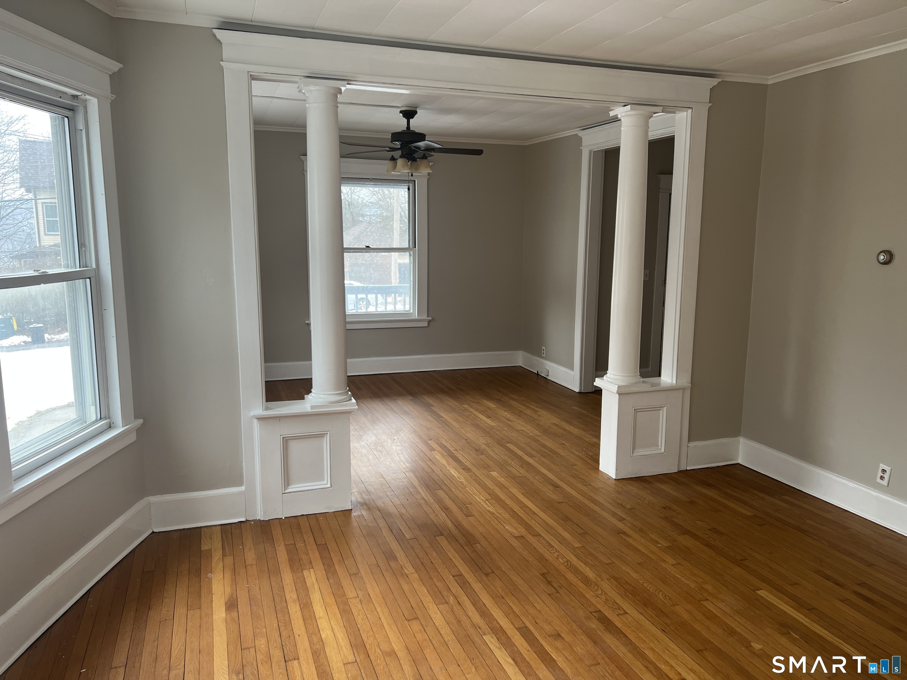40 Prospect Street Ansonia, CT 06401 - Photo 15 of 31 an empty room with wooden floor and windows