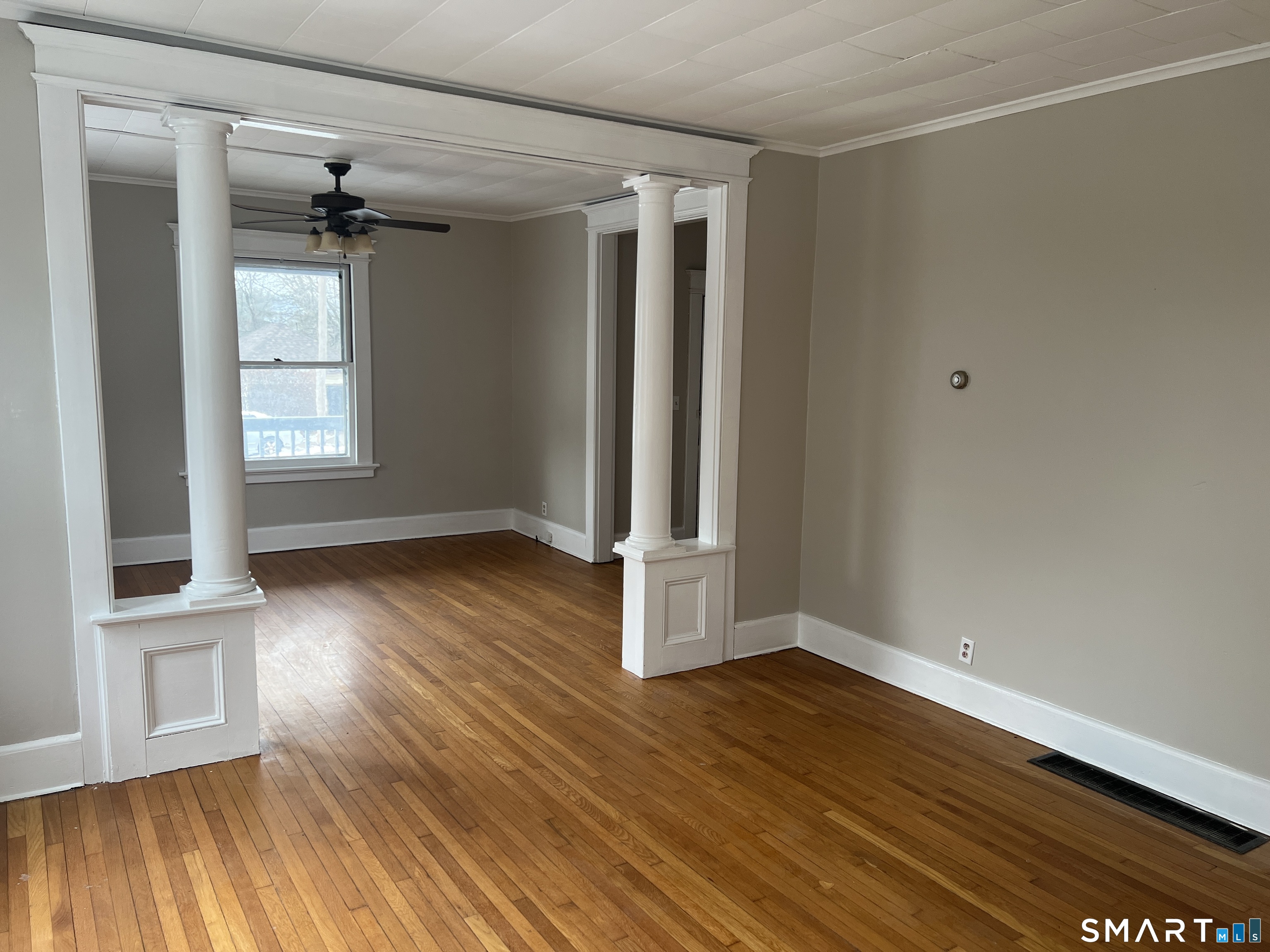 40 Prospect Street Ansonia, CT 06401 - Photo 16 of 31 an empty room with wooden floor and windows