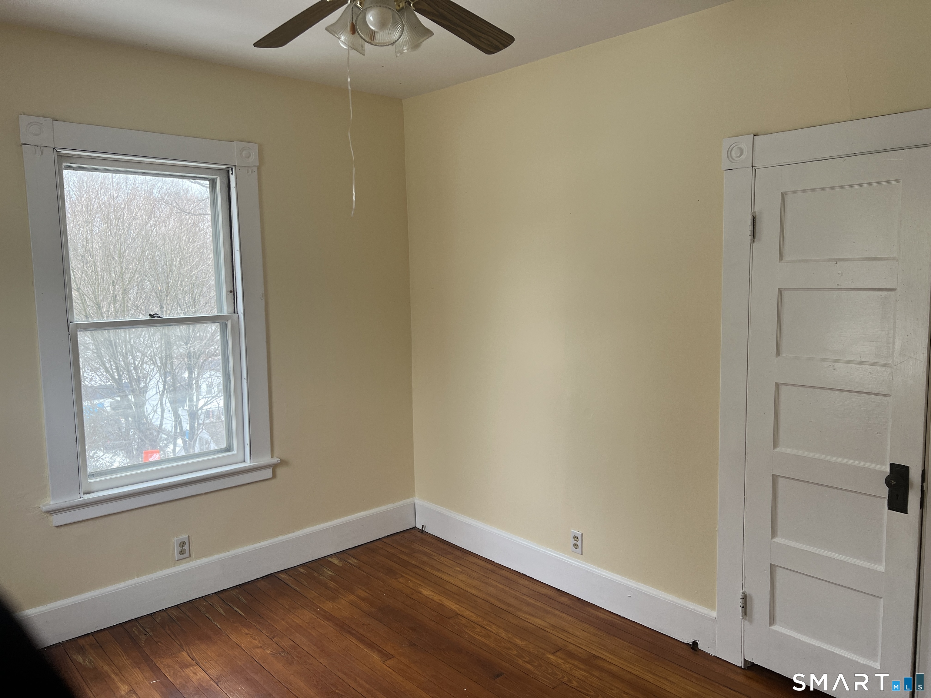 40 Prospect Street Ansonia, CT 06401 - Photo 24 of 31 a view of an empty room with wooden floor and a window