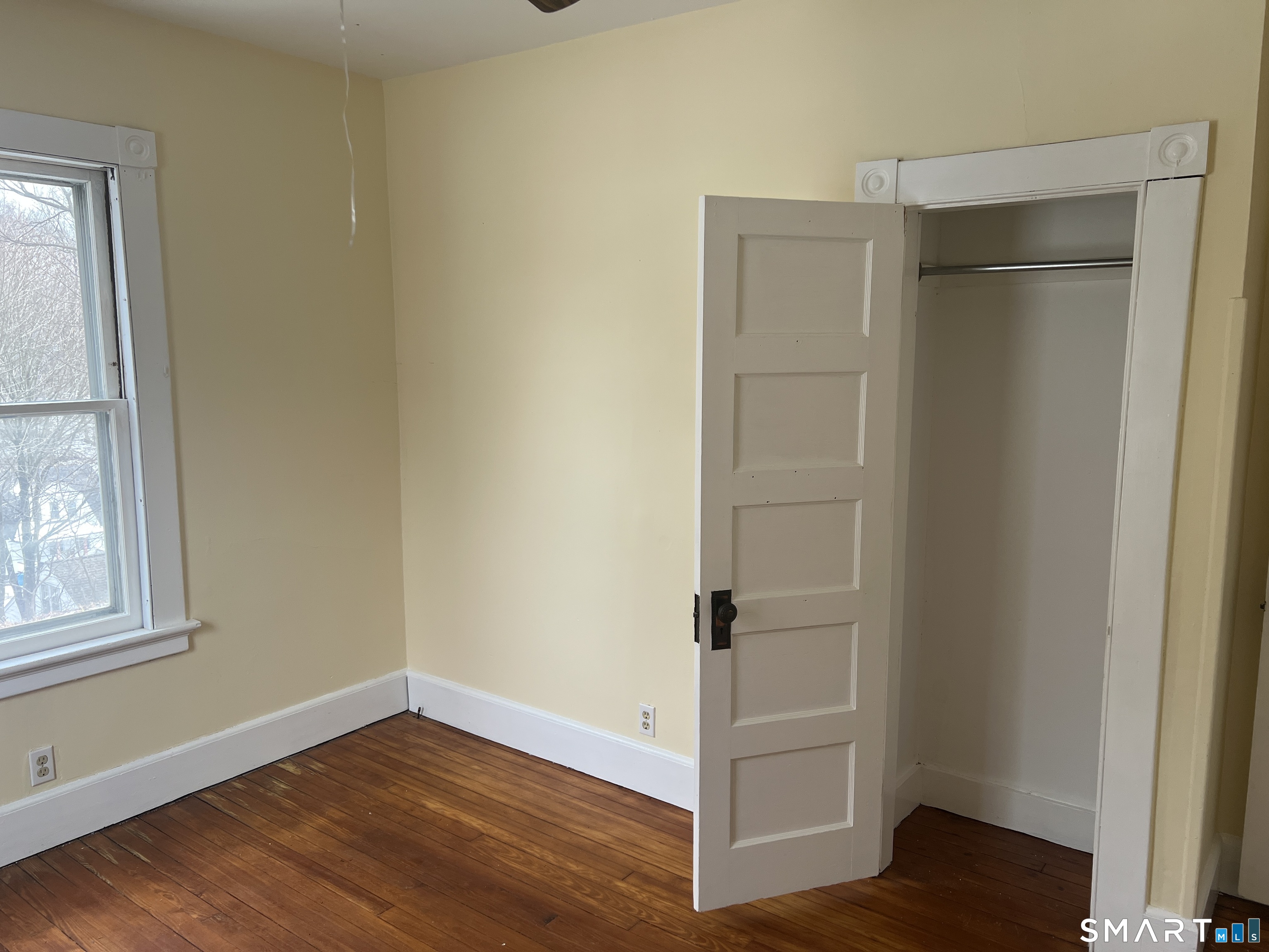 40 Prospect Street Ansonia, CT 06401 - Photo 25 of 31 a view of an empty room with wooden floor and a window