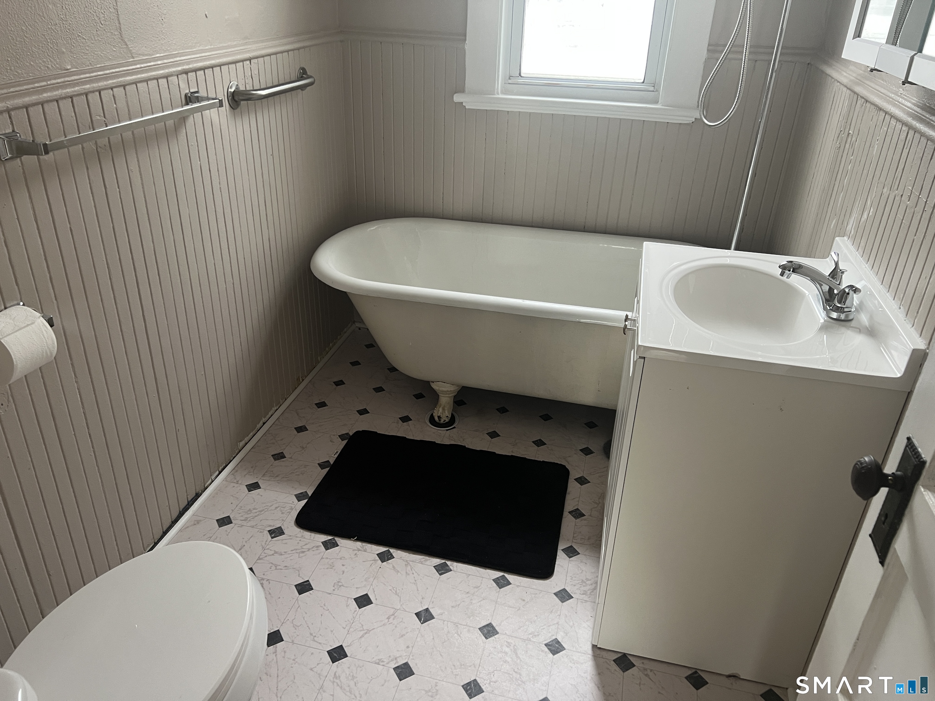 40 Prospect Street Ansonia, CT 06401 - Photo 28 of 31 a bathroom with a sink toilet and shower