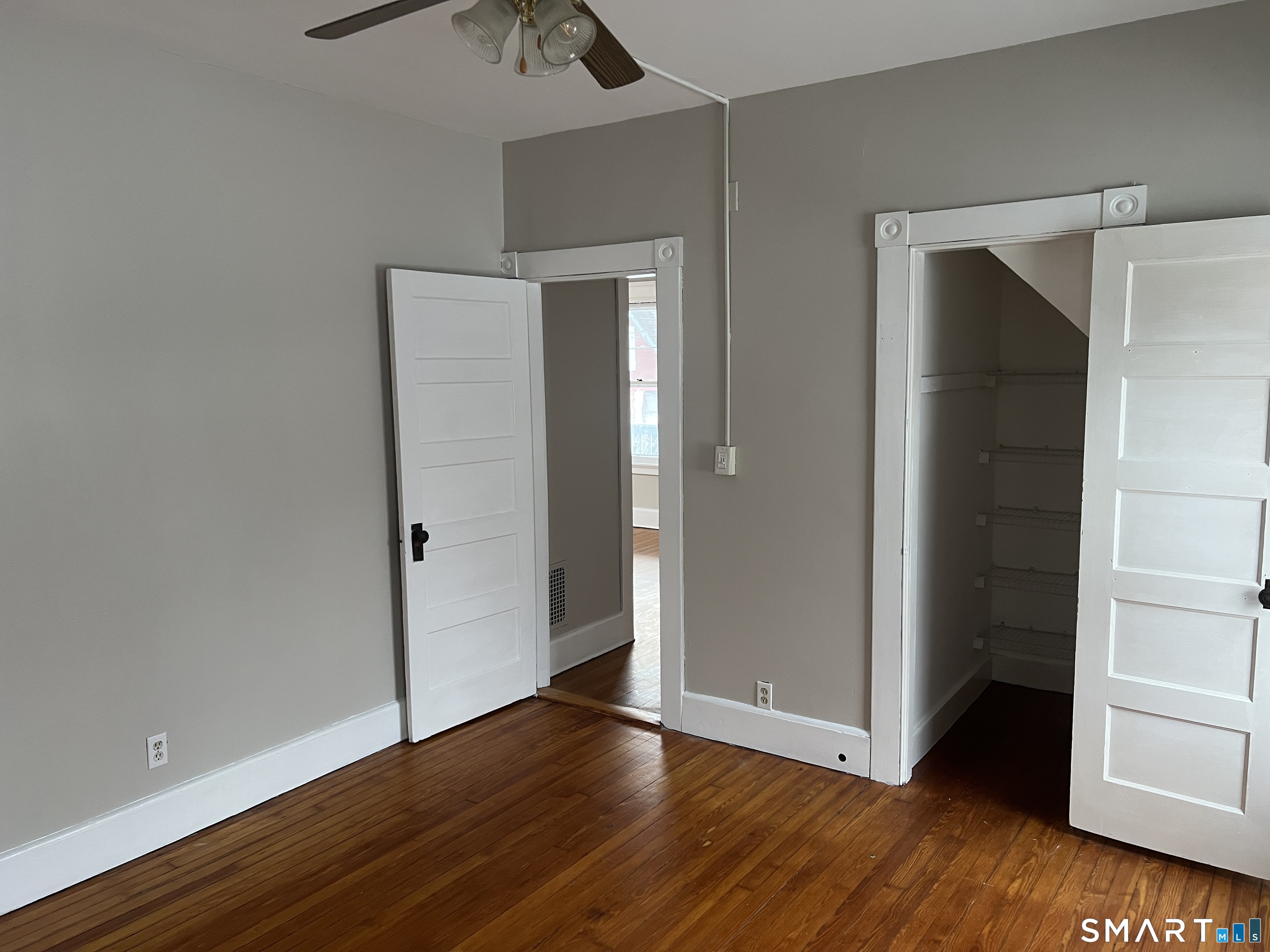 40 Prospect Street Ansonia, CT 06401 - Photo 30 of 31 an empty room with wooden floor and closet
