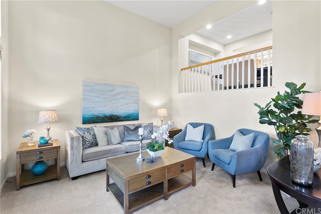 44 Modesto Irvine, CA 92602 - Photo 2 of 35 a living room with furniture and a potted plant
