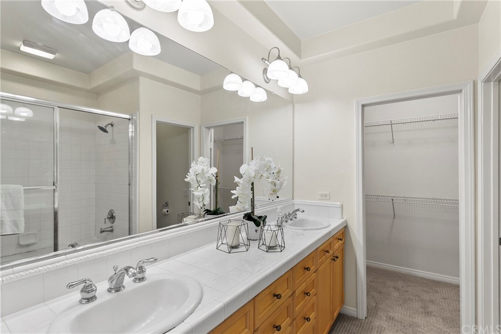 44 Modesto Irvine, CA 92602 - Photo 12 of 35 a bathroom with a double vanity sink mirror and double