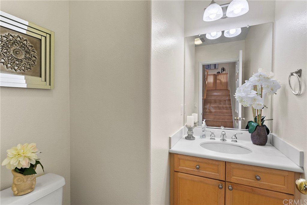 44 Modesto Irvine, CA 92602 - Photo 8 of 35 a bathroom with a sink vanity and a mirror