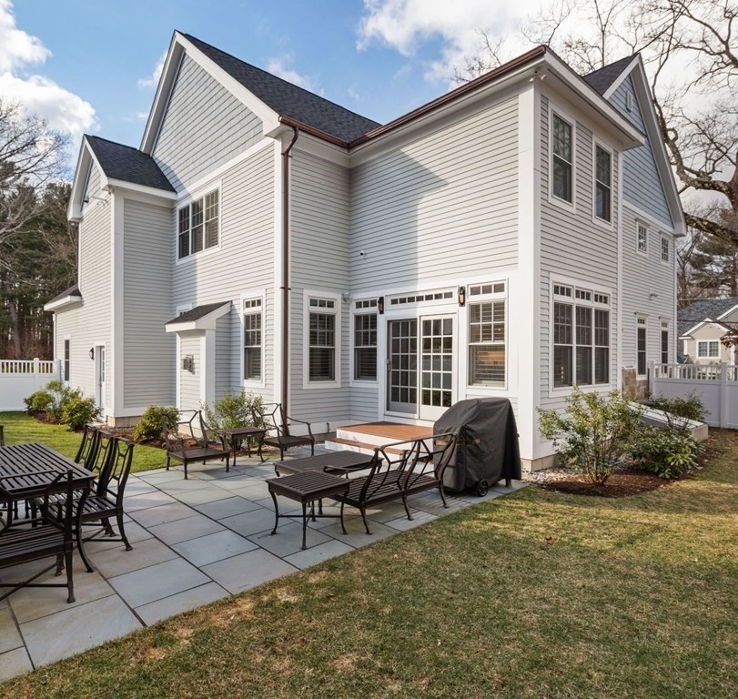 48 MacArthur Road Wellesley, MA 02482 - Photo 24 of 26 a building outdoor space with patio furniture and potted plants