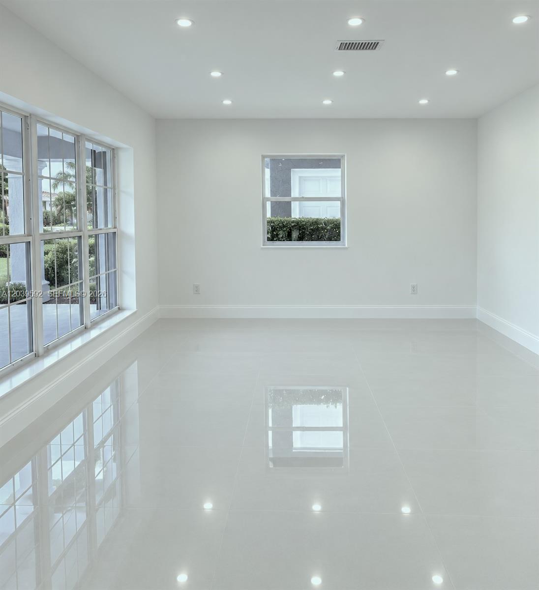 18935 Northwest 8th Avenue Miami Gardens, FL 33169 - Photo 4 of 26 a view of an empty room with a window