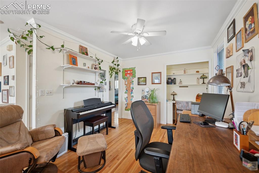 985 Fuller Road Colorado Springs, CO 80920 - Photo 11 of 30 a view of a workspace with furniture and a window