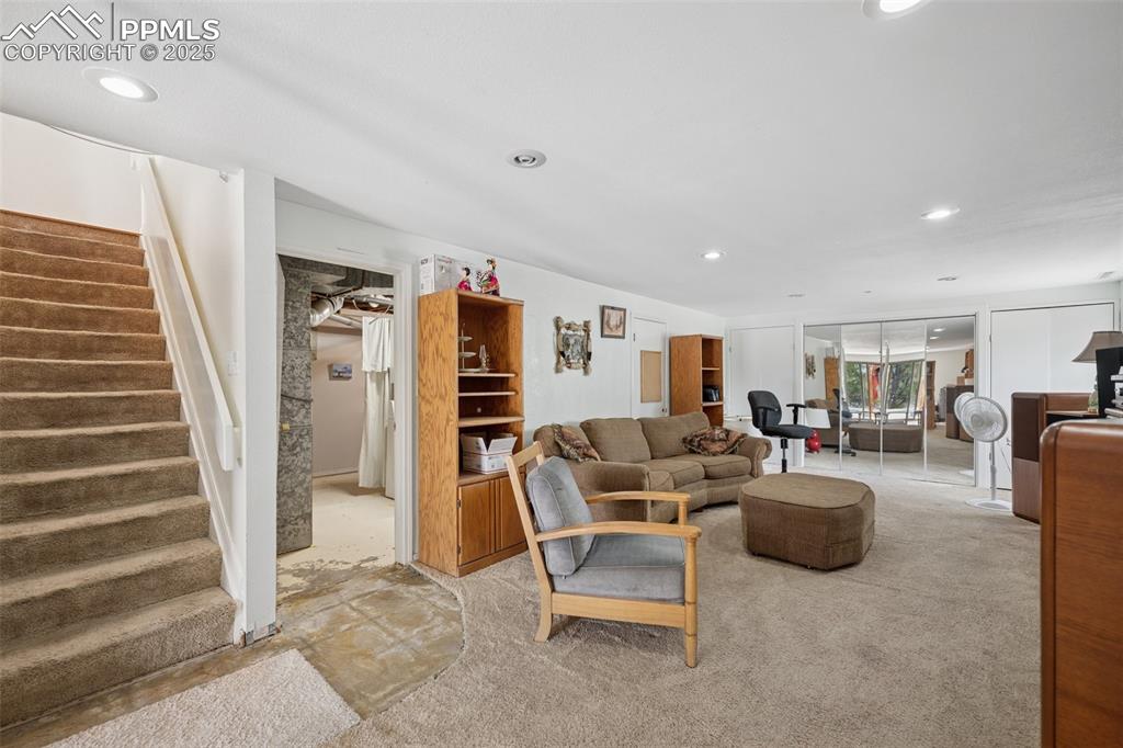 985 Fuller Road Colorado Springs, CO 80920 - Photo 21 of 30 a living room with furniture and a wooden floor