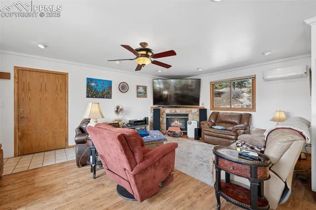 a dining room with furniture a rug and wooden floor