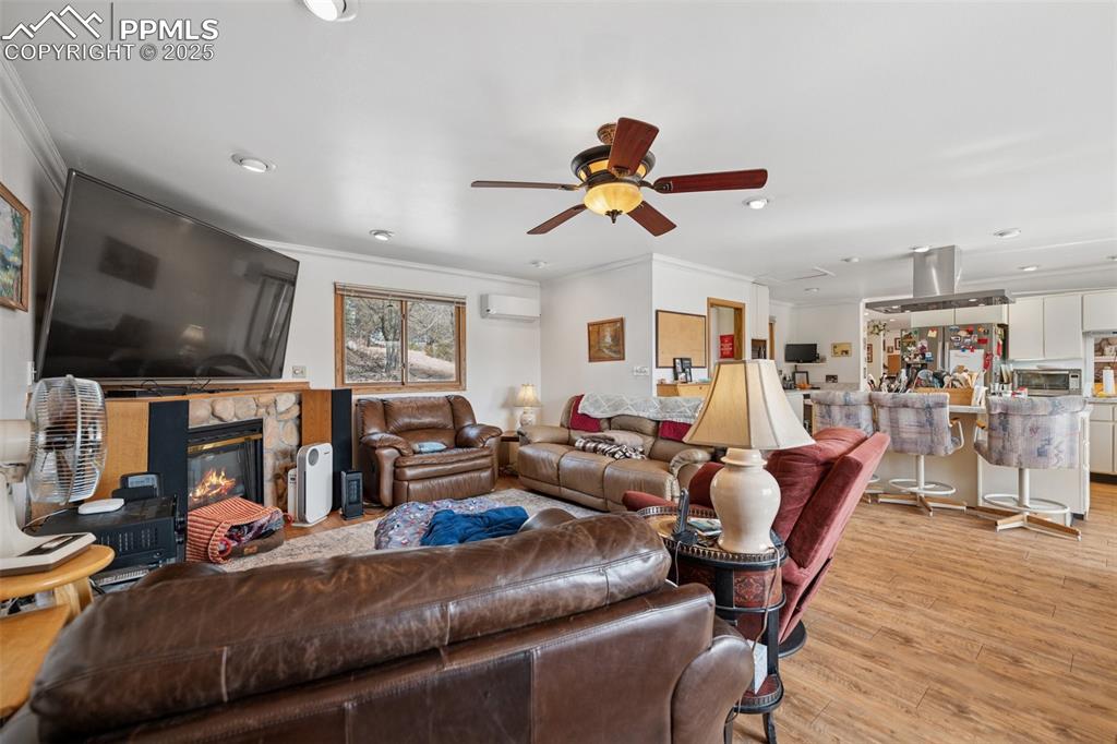 985 Fuller Road Colorado Springs, CO 80920 - Photo 6 of 30 a living room with furniture and a flat screen tv