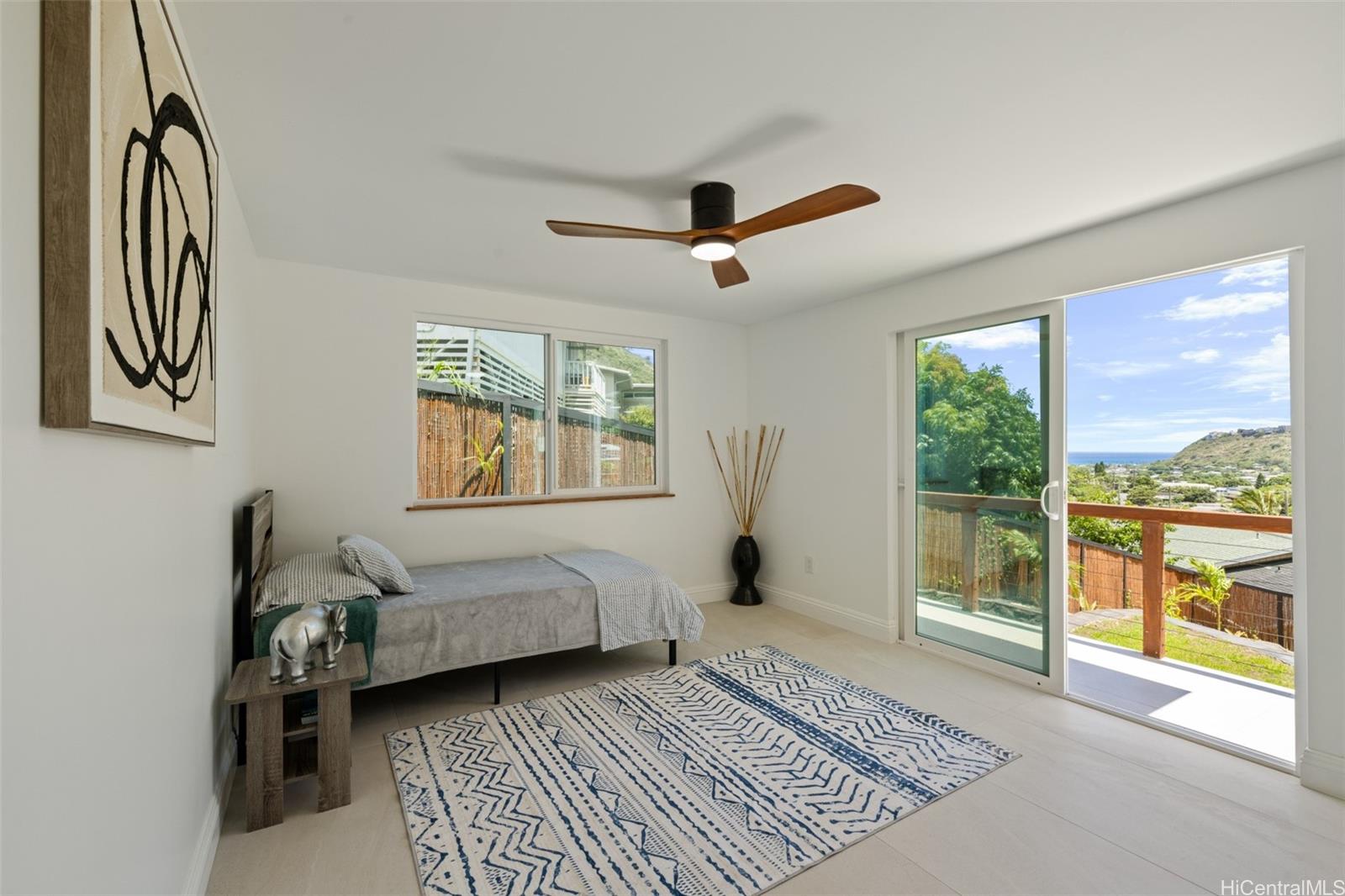 852 Kainoa Place Honolulu, HI 96821 - Photo 13 of 25 a living room with a balcony furniture and a window