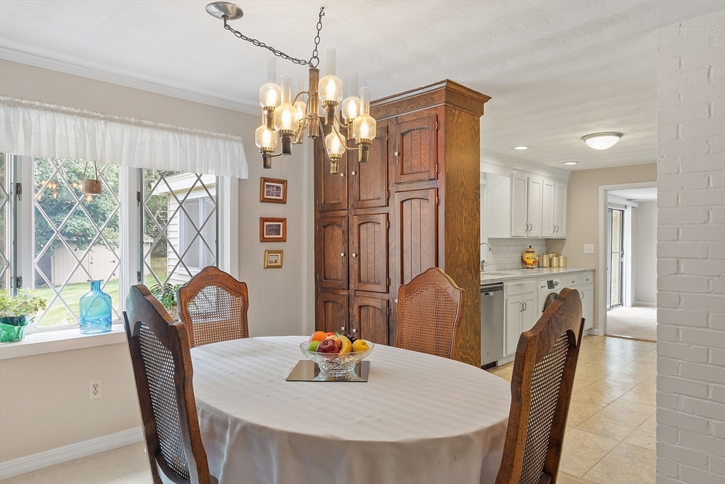 11 Parlee Road Chelmsford, MA 01824 - Photo 11 of 33 a dining room with furniture a chandelier and window