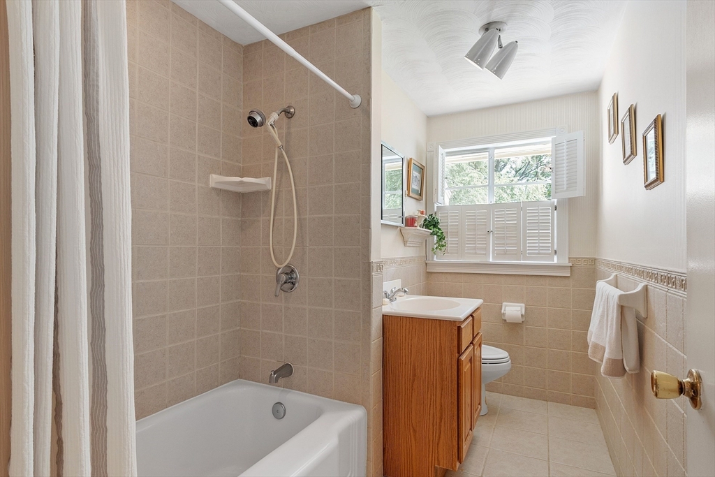 11 Parlee Road Chelmsford, MA 01824 - Photo 18 of 33 a bathroom with a sink a toilet and shower