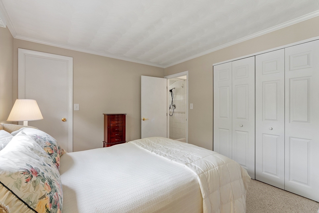 11 Parlee Road Chelmsford, MA 01824 - Photo 22 of 33 a bedroom with a bed and a lamp