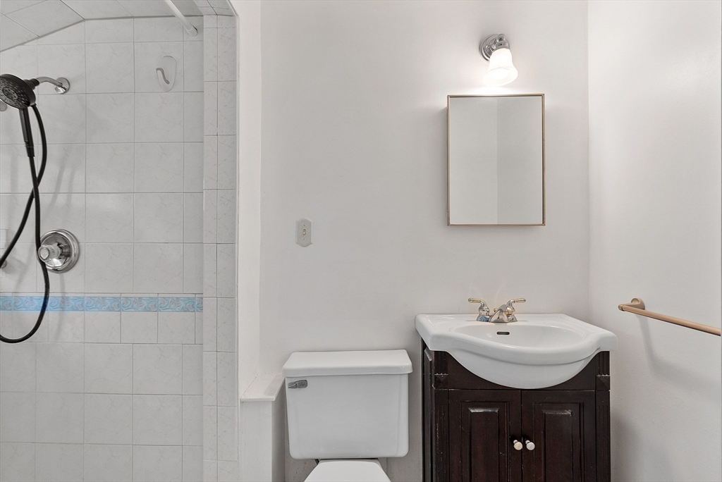 11 Parlee Road Chelmsford, MA 01824 - Photo 23 of 33 a bathroom with a sink vanity and a toilet