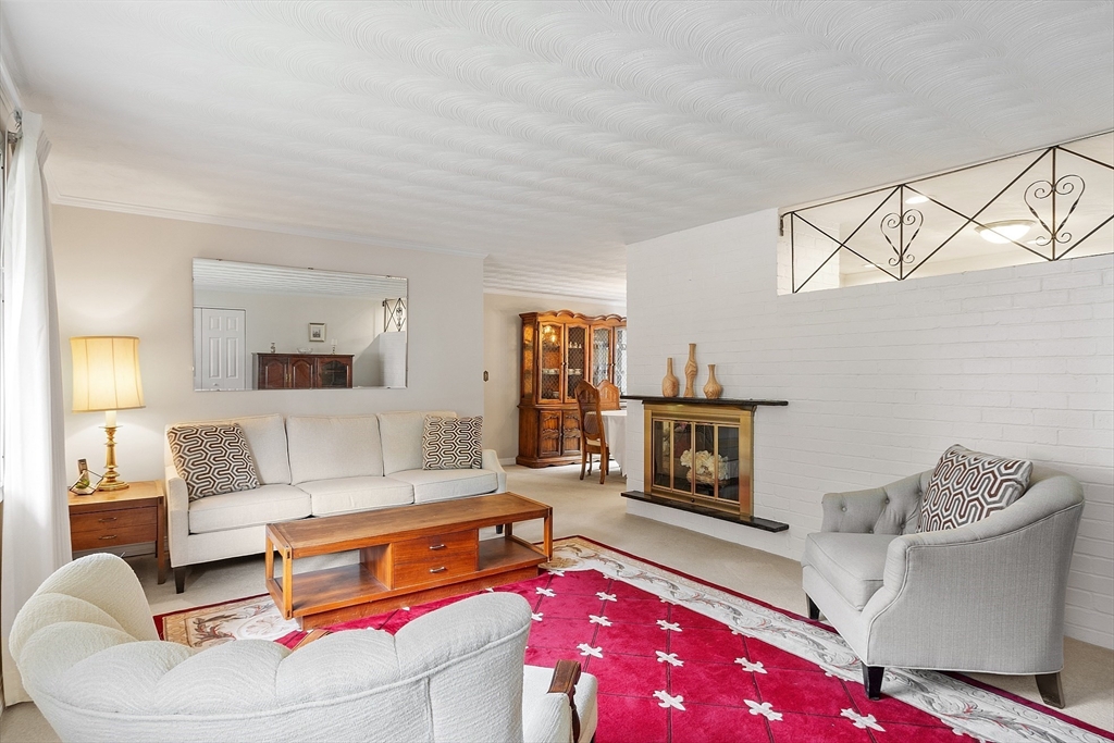 11 Parlee Road Chelmsford, MA 01824 - Photo 4 of 33 a living room with furniture and wooden floor