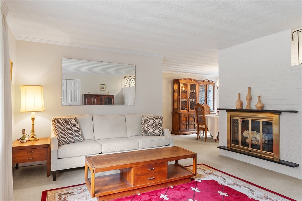 11 Parlee Road Chelmsford, MA 01824 - Photo 5 of 33 a living room with furniture and a fireplace