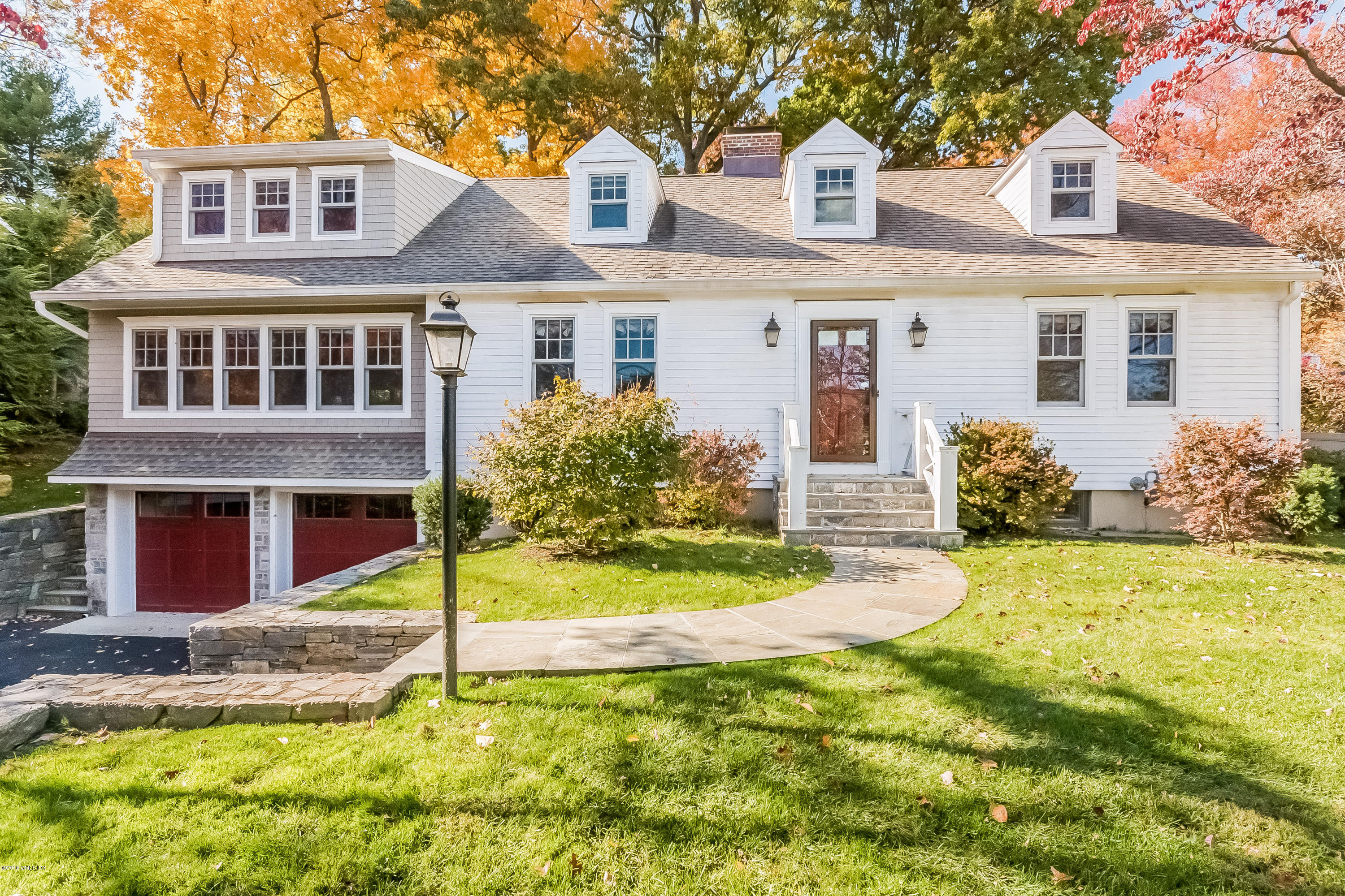 355 Riverside Avenue Riverside, CT 06878 - Photo 1 of 24 a front view of a house with a yard