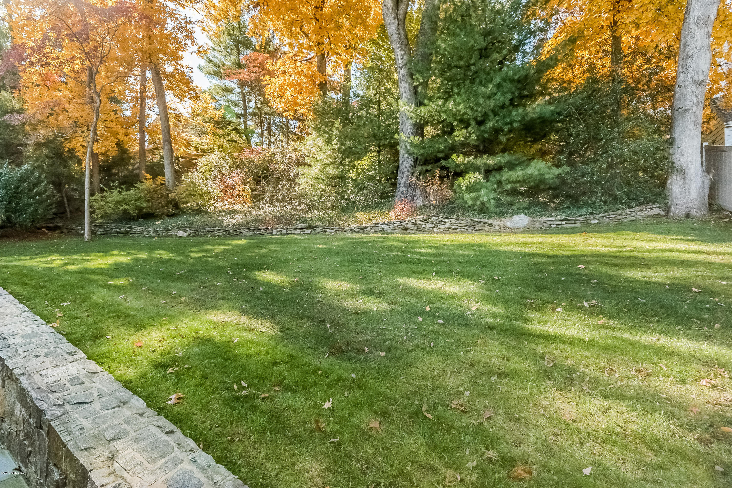 355 Riverside Avenue Riverside, CT 06878 - Photo 16 of 24 a view of outdoor space with trees all around