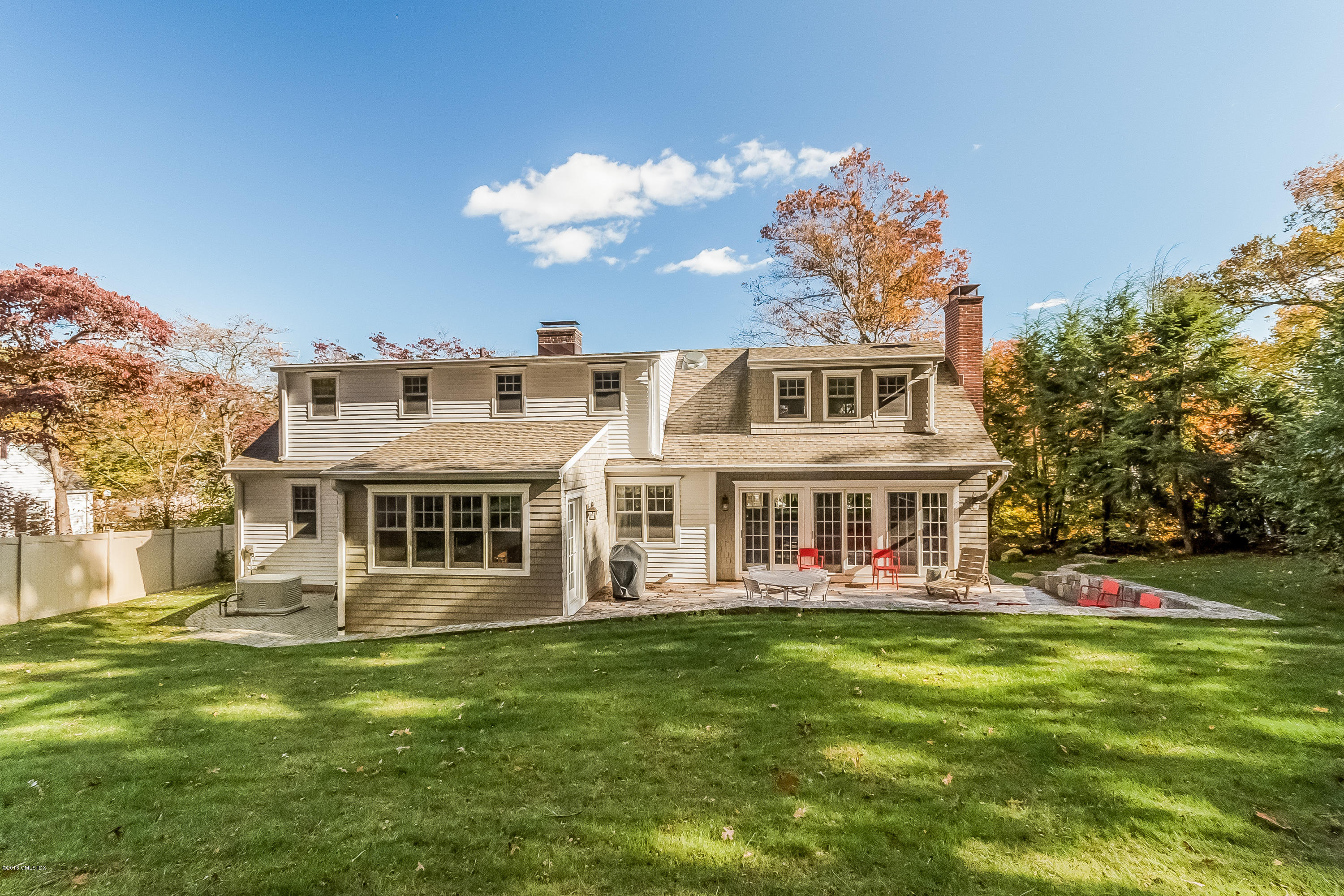 355 Riverside Avenue Riverside, CT 06878 - Photo 18 of 24 a front view of a house with a garden and trees