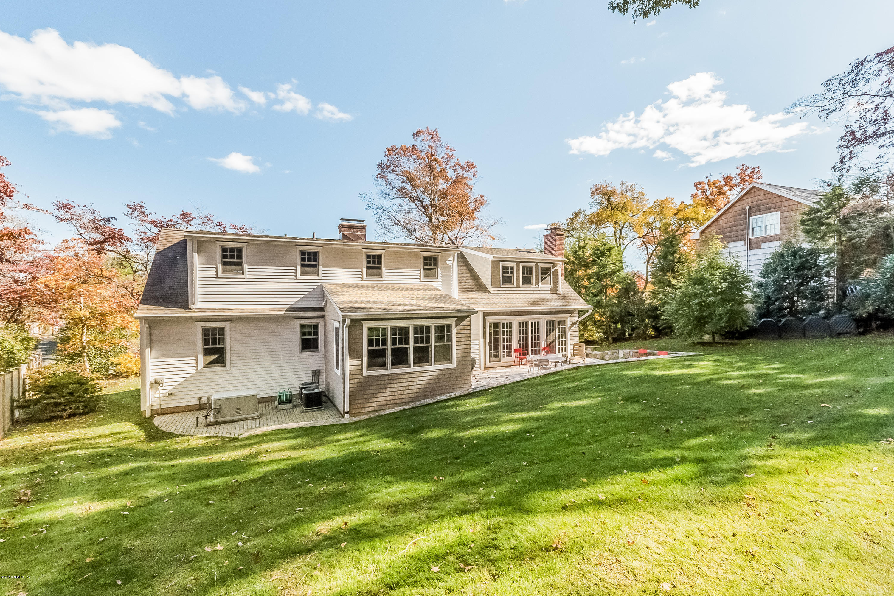 355 Riverside Avenue Riverside, CT 06878 - Photo 19 of 24 a front view of a house with a garden