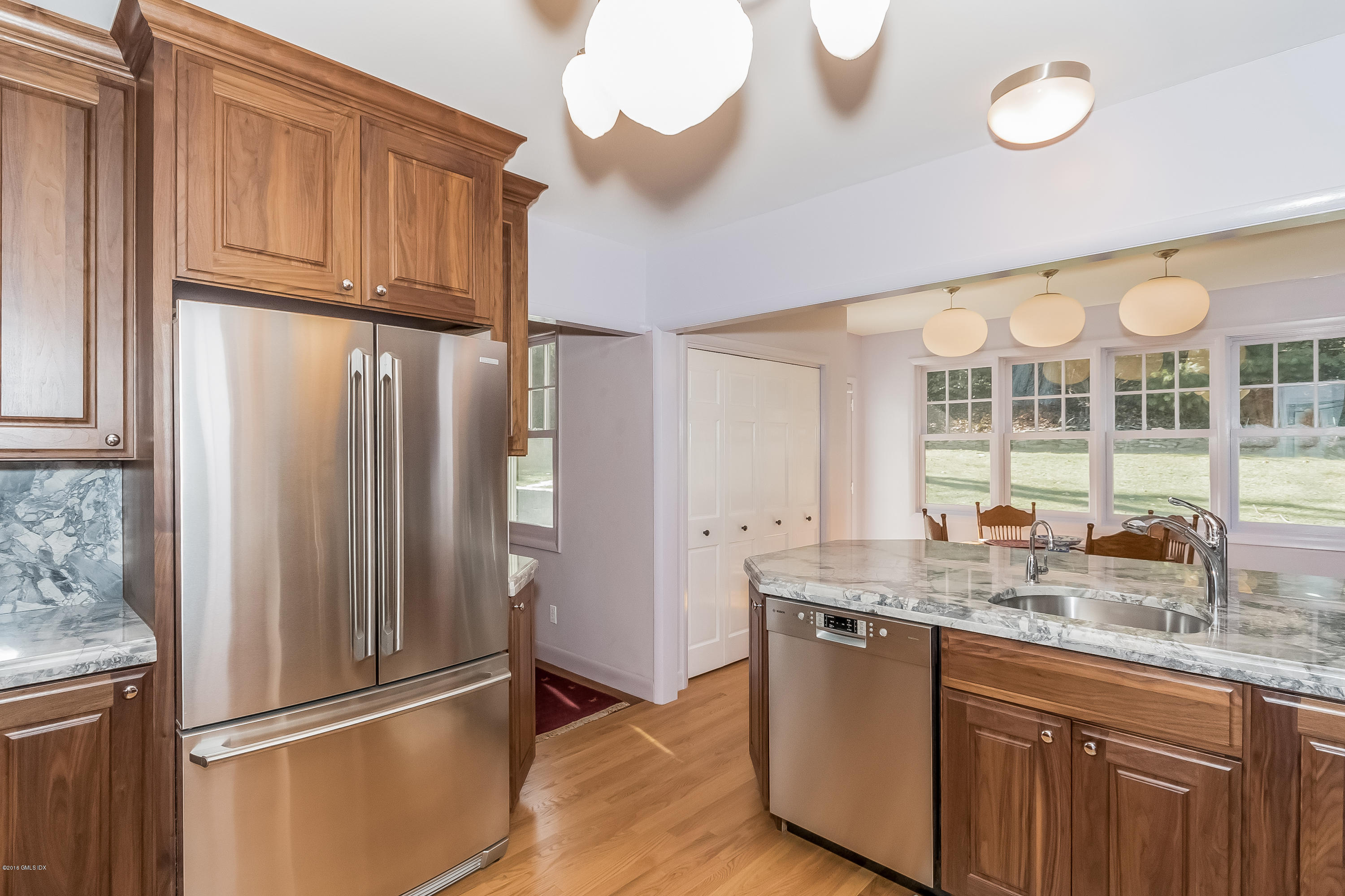 355 Riverside Avenue Riverside, CT 06878 - Photo 5 of 24 a kitchen with stainless steel appliances granite countertop a refrigerator and a sink