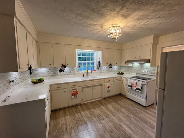 1386 Chisholm Road Cypress Inn, TN 38452 - Photo 21 of 58 a kitchen with a sink stove and refrigerator