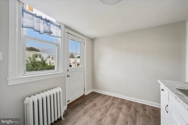 a view of an empty room and window