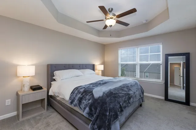 a bedroom with a large bed and a window