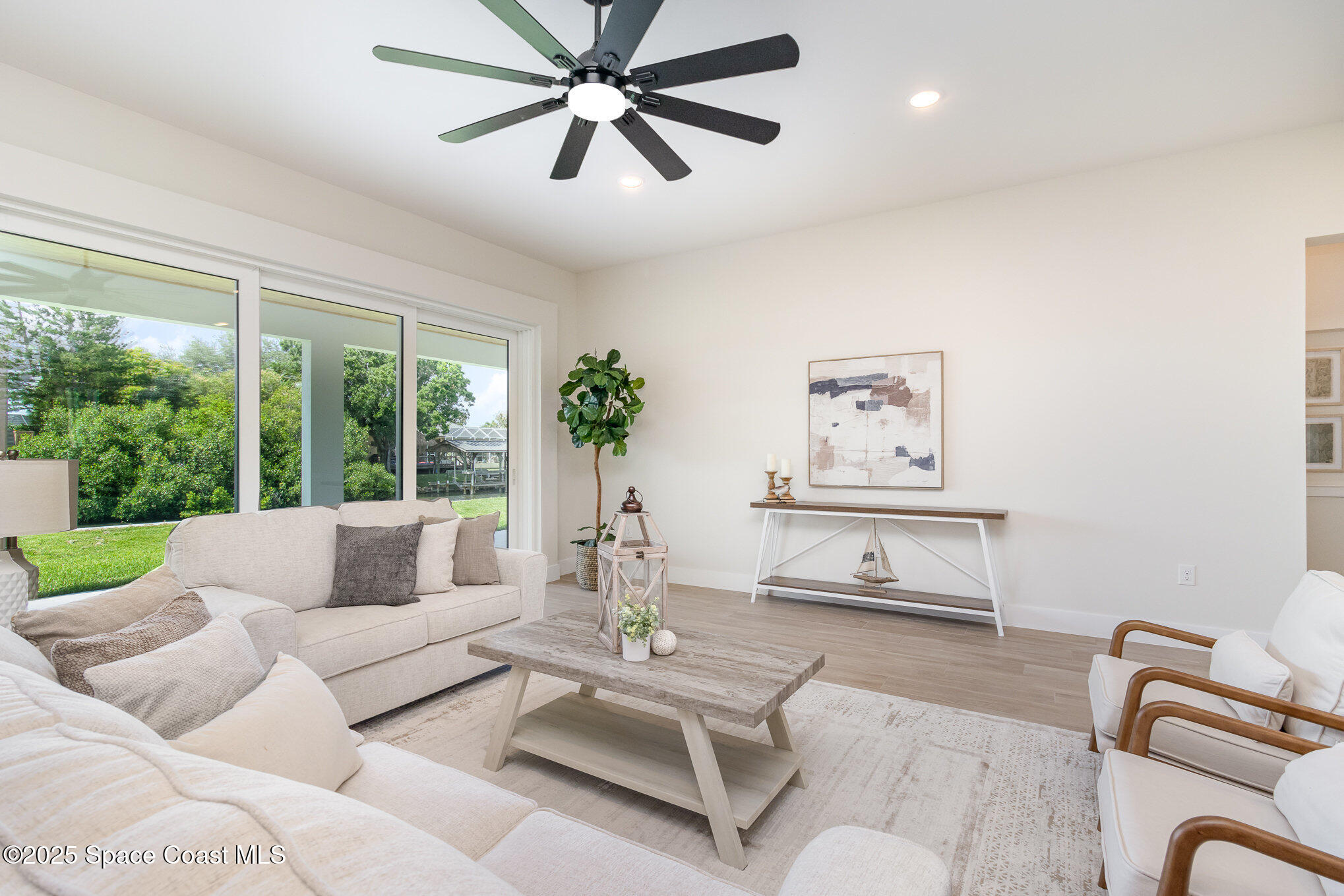 508 Topsail Drive Rockledge, FL 32955 - Photo 14 of 41 a living room with furniture and a large window