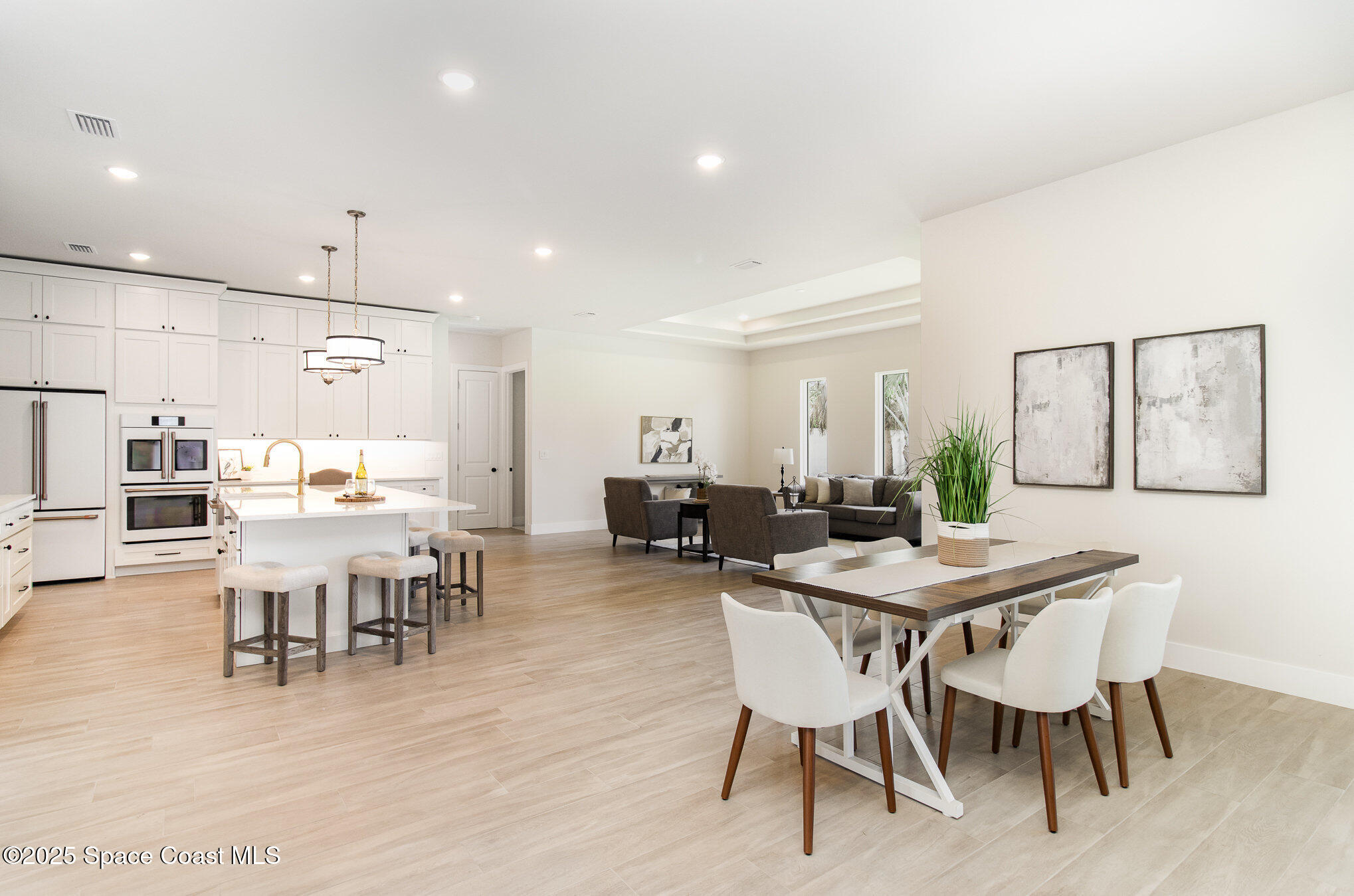 508 Topsail Drive Rockledge, FL 32955 - Photo 18 of 41 a view of a dining room with furniture and wooden floor