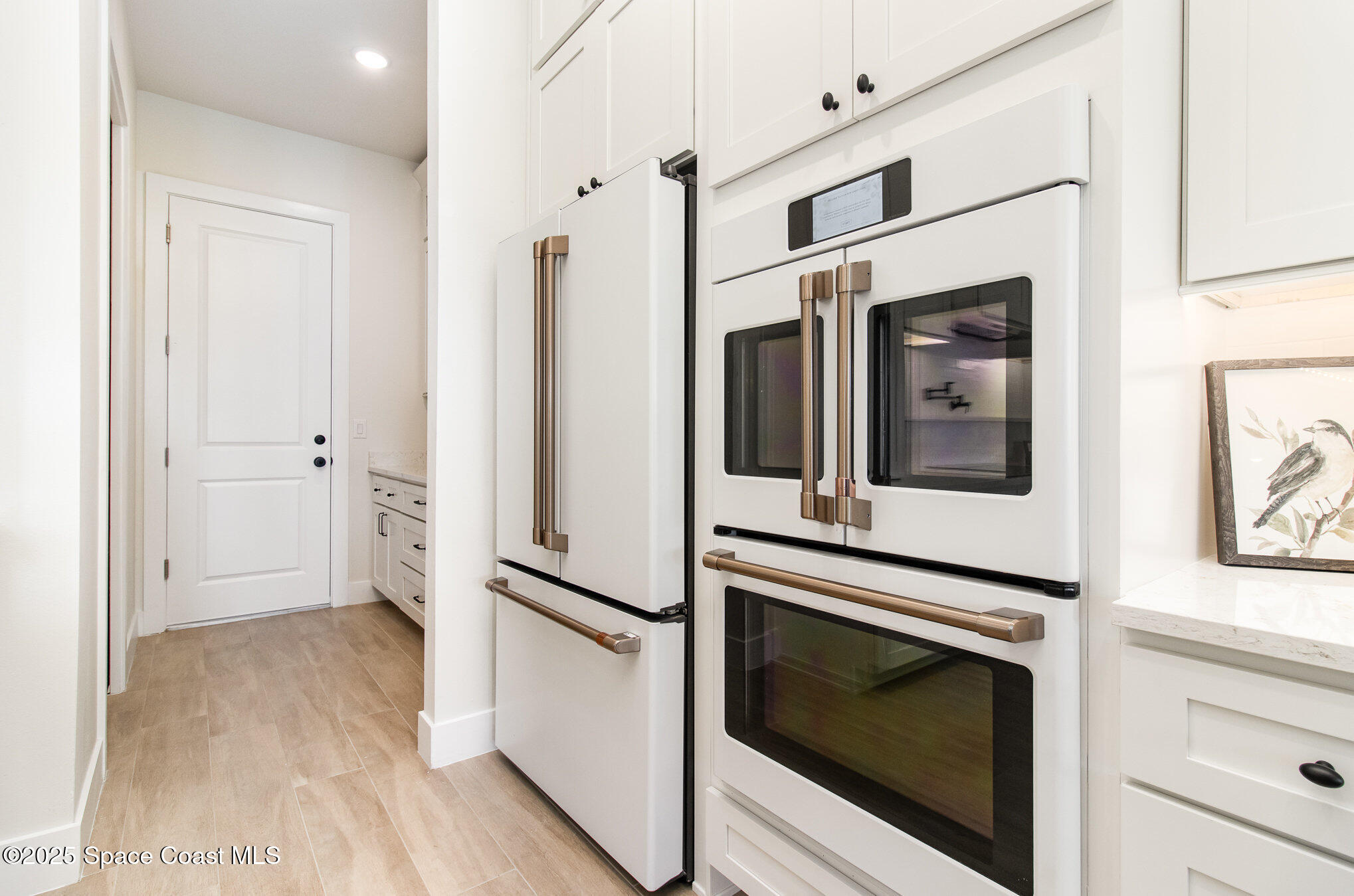 508 Topsail Drive Rockledge, FL 32955 - Photo 22 of 41 a view of a hallway with wooden floor and staircase