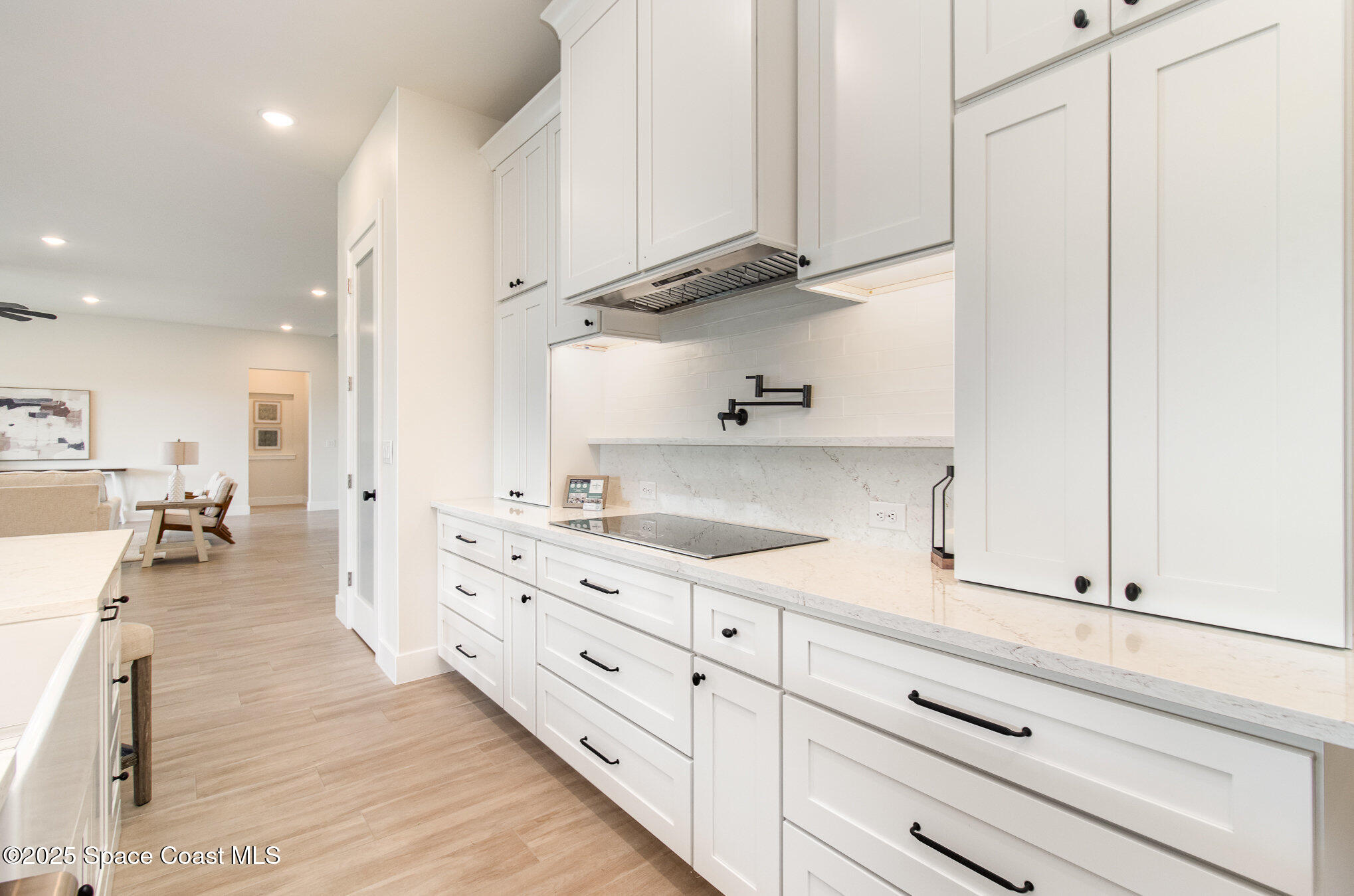 508 Topsail Drive Rockledge, FL 32955 - Photo 23 of 41 a kitchen with white cabinets and sink