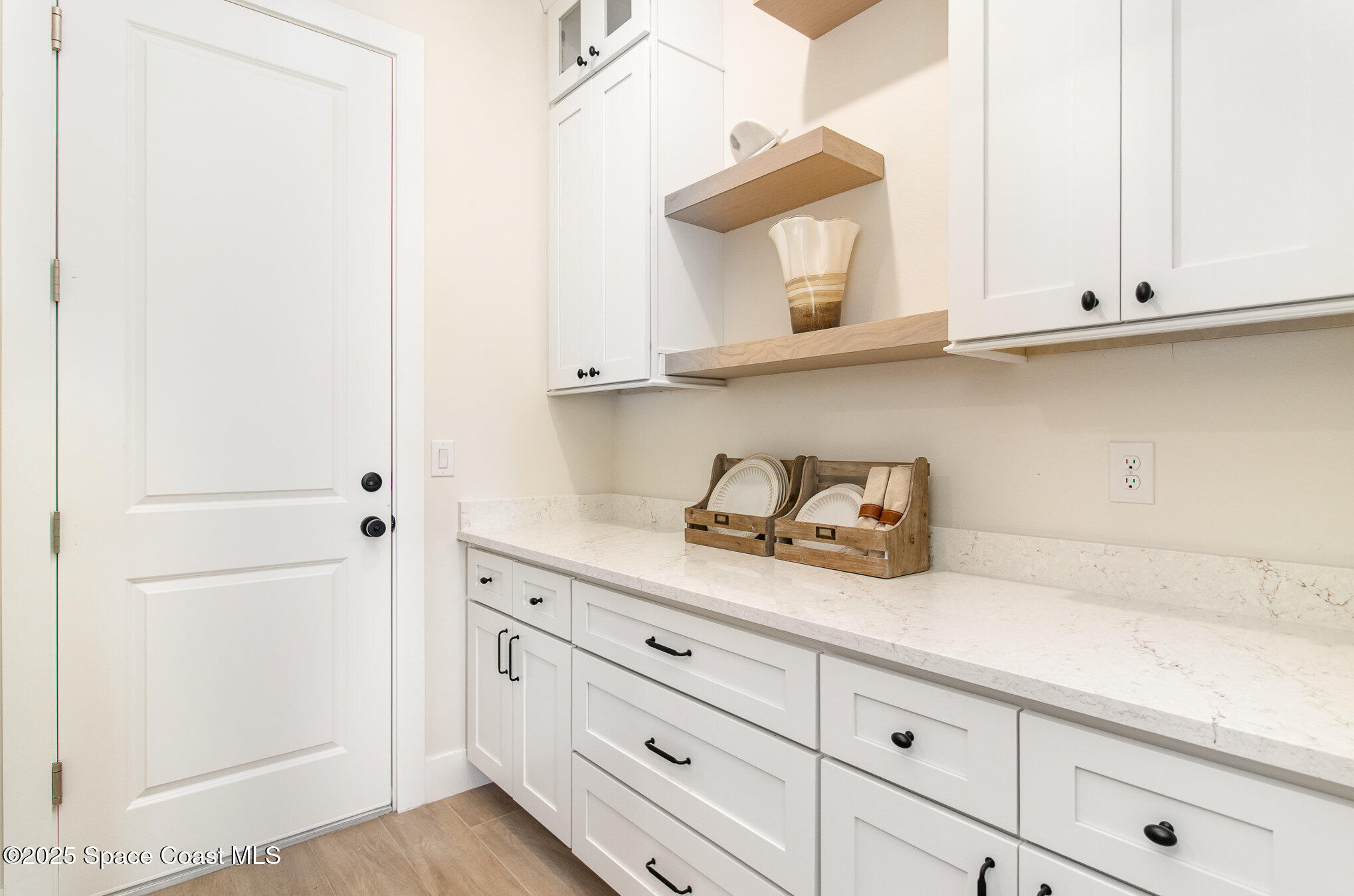 508 Topsail Drive Rockledge, FL 32955 - Photo 24 of 41 a kitchen with cabinets and window
